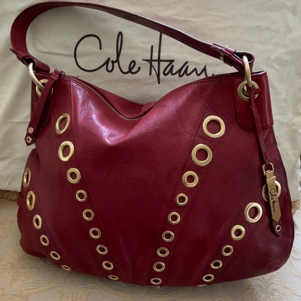 red leather hobo bag w/ gold tone hardware.